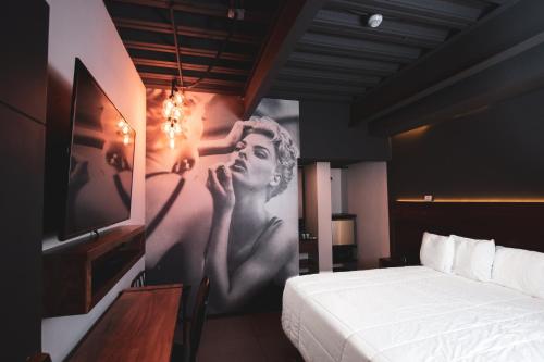 Postel nebo postele na pokoji v ubytování HOTEL RIO RITA