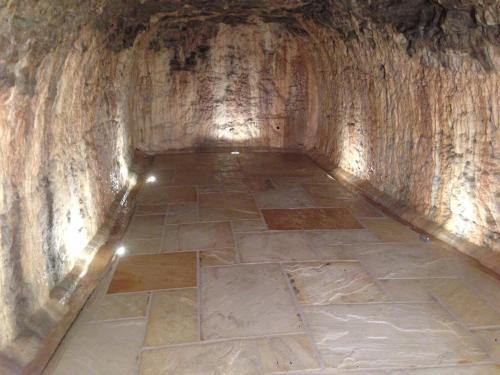 a tunnel with a tile floor in a cave at Hotel Restaurant zur Windmühle in Ansbach