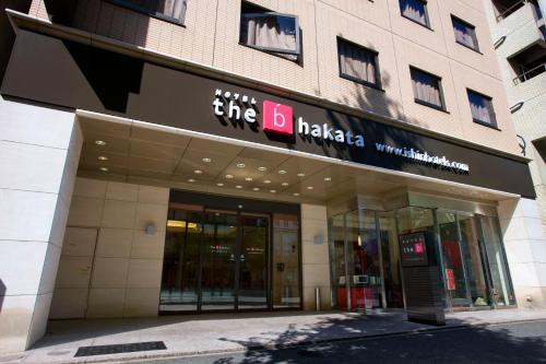 a building with a sign on the front of it at the b hakata in Fukuoka