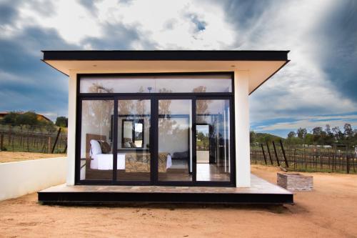a small room with a bed in it at Quinta Nicolás Valle de Guadalupe in Valle de Guadalupe