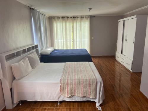 Katil atau katil-katil dalam bilik di Triplex Costazul Temporada