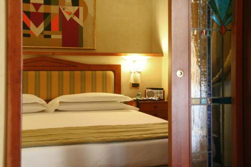 Postel nebo postele na pokoji v ubytování Best Western Hotel Artdeco