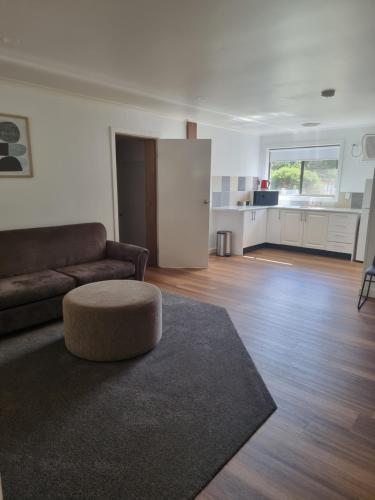 a living room with a couch and a table at The Rocks Apartments in Halls Gap