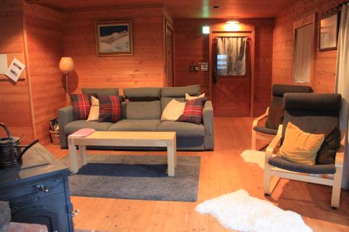 Χώρος καθιστικού στο Alpine Chalets Hakuba