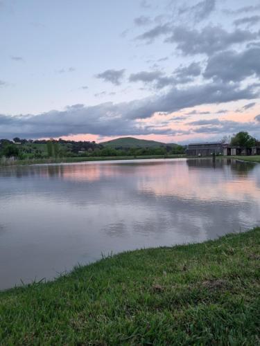 a body of water with a cloudy sky at Mansfield Holiday Park in Mansfield