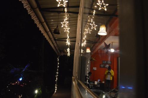a room with christmas lights hanging from a ceiling at Zemu Gangtok in Gangtok