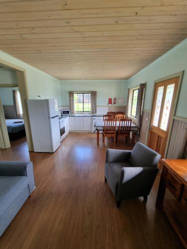 a large living room with a kitchen and a table at Mansfield Holiday Park in Mansfield