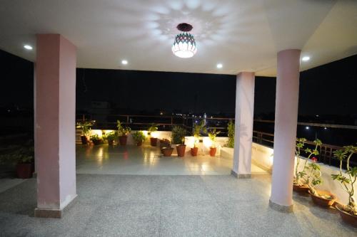 a building with a lit up patio at night at Hotel The Omaira in Jaipur