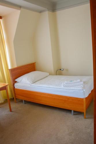 Postel nebo postele na pokoji v ubytování Hotel Praha Liberec