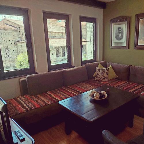 a living room with a couch and a coffee table at Jovanovic Guest House in Ohrid