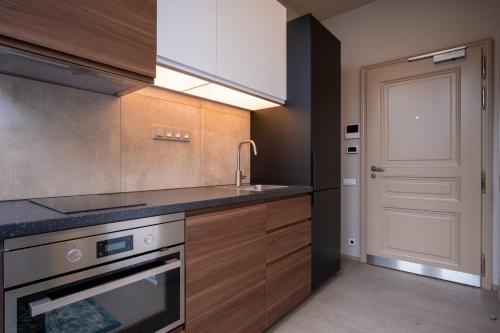Kuchyň nebo kuchyňský kout v ubytování Aparthotel Rimska 14