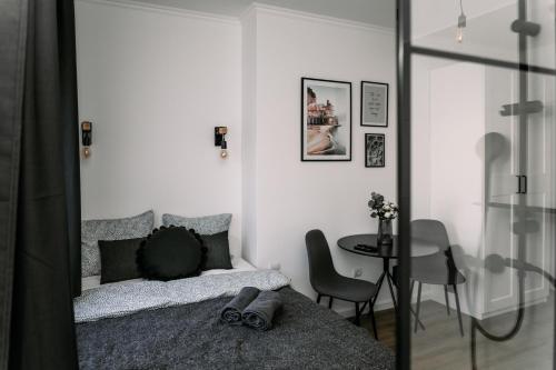 En eller flere senge i et værelse på B15 - Wood&Black Apartman