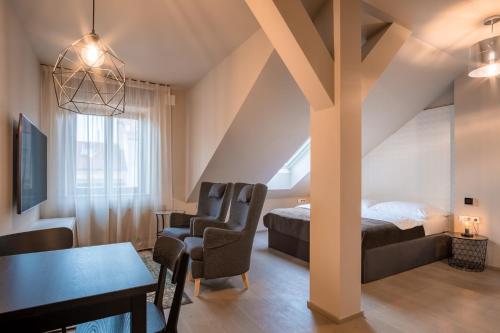 TV a/nebo společenská místnost v ubytování Aparthotel Rimska 14