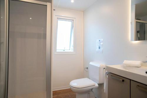 a bathroom with a toilet and a sink and a shower at Camping Europa in Capoliveri