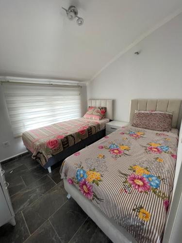 Кровать или кровати в номере BELKA GOLF RESIDENCE Exclusive apt DeluxBELEK
