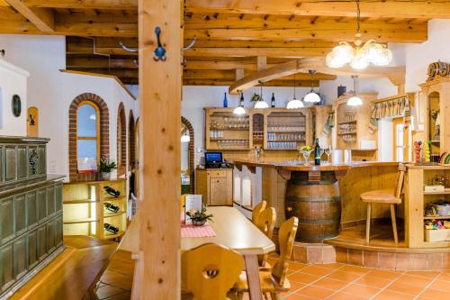 a kitchen with a table and a wine cellar at Gästezimmer Steiner in Gamlitz