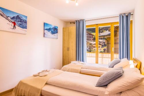 Postel nebo postele na pokoji v ubytování Chalet Aquila 2