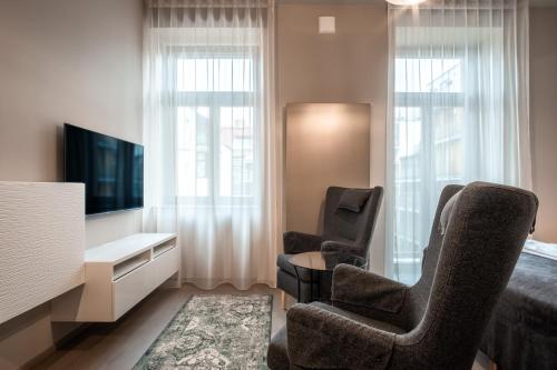 TV a/nebo společenská místnost v ubytování Aparthotel Rimska 14