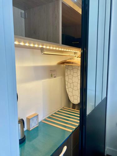 a kitchen with a refrigerator with a counter top at Cannes City B&B in Cannes