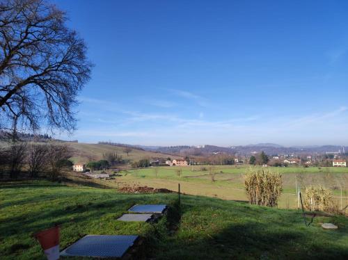 a field with several solar panels on a hill at QOELET - B&B Etico e Sociale in Montevarchi