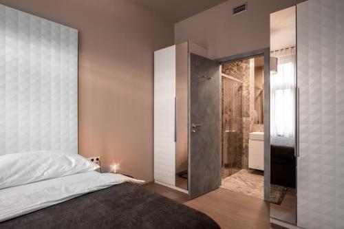 Postel nebo postele na pokoji v ubytování Aparthotel Rimska 14