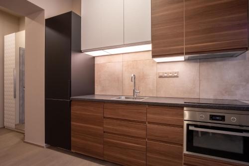 Kuchyň nebo kuchyňský kout v ubytování Aparthotel Rimska 14