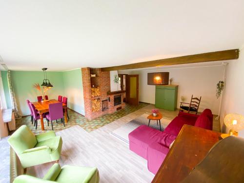 a living room with a couch and a table at Ferienwohnung Hemmerle in Bispingen