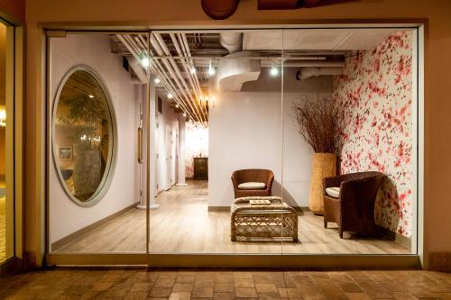 a room with two chairs and a glass door at The Ivy at Verity in Toronto