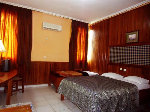 Cama o camas de una habitación en HOTEL SAFFANA