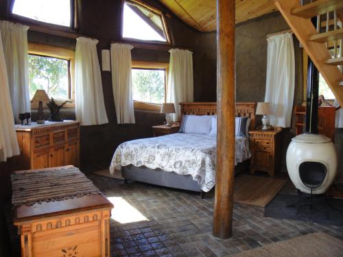 מיטה או מיטות בחדר ב-The Funny Farm Shire