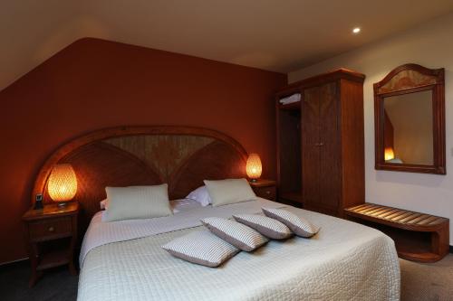 Ein Bett oder Betten in einem Zimmer der Unterkunft Hotel Martinique