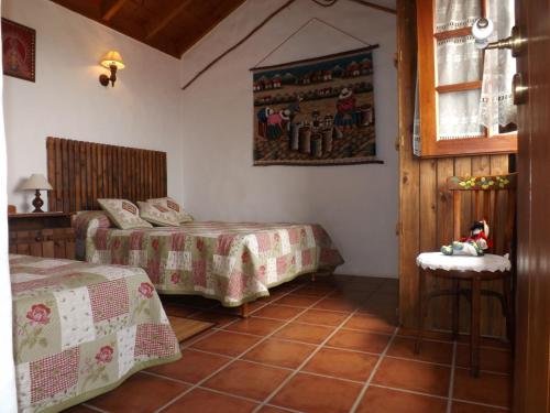 En eller flere senger på et rom på Casa Rural La Cuna