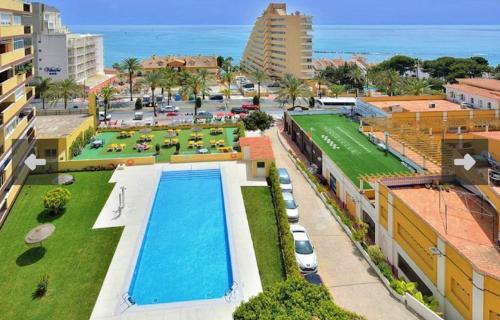 an aerial view of a resort with a swimming pool at New 2023 Don Gustavo, Beach Front, Sea Views in Benalmádena