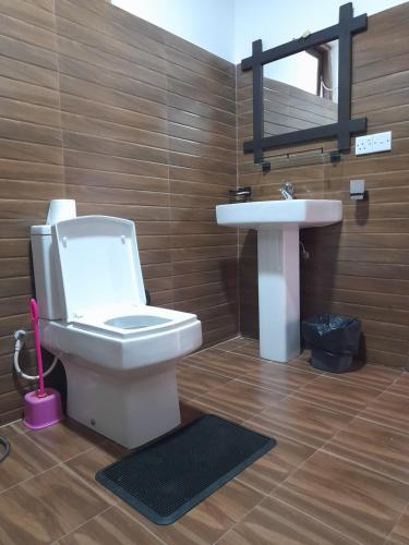a bathroom with a toilet and a sink at Nine Arch Gap in Ella