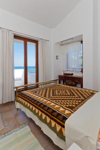 Ένα ή περισσότερα κρεβάτια σε δωμάτιο στο Del Sol Skopelos