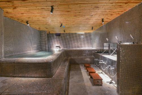 a large bathroom with a tub and a sink at 22Land Hotel & Residence in Hanoi