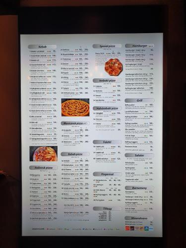 a white menu for a restaurant with pizzas on it at Motell Svinesundparken in Halden