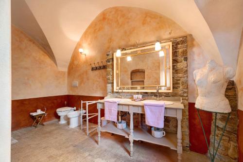 a bathroom with a sink and a mirror at Residenza Stoechas in Albenga