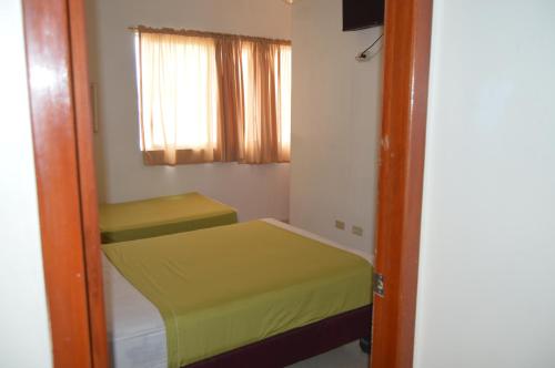 Hostal El Naufrago 1にあるベッド