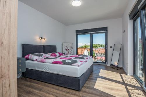 Postel nebo postele na pokoji v ubytování Villa Ivi