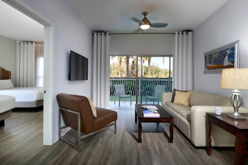 a living room with a couch and a chair at Meliá Orlando Celebration in Orlando