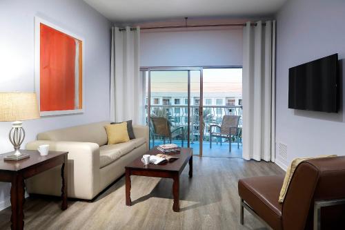 a living room with a couch and a table at Meliá Orlando Celebration in Orlando