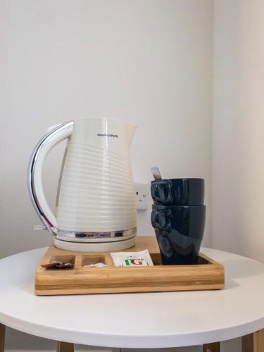 a blender sitting on a table with a cup at Smart Hyde Park Inn in London