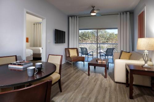 a living room with a couch and a table at Meliá Orlando Celebration in Orlando