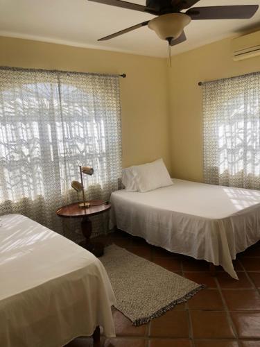 A bed or beds in a room at Pura Vida Jamaica