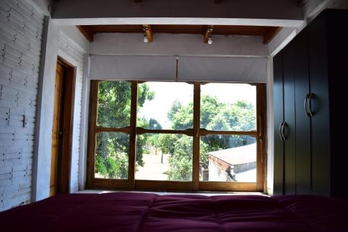 Кровать или кровати в номере Casa Cumandai