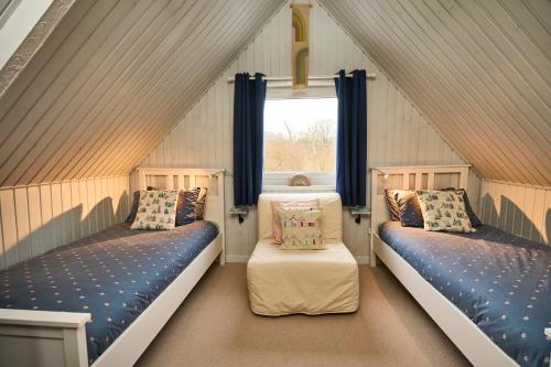 A bed or beds in a room at The Moorings, overlooking Loch Fyne
