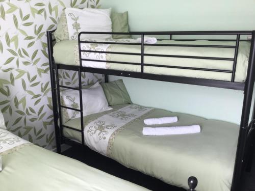 a couple of bunk beds in a room at The Benson Hotel in Blackpool