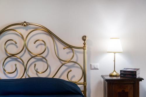 Ένα ή περισσότερα κρεβάτια σε δωμάτιο στο Borgo Macereto