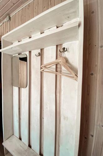 a wooden wall with a window in a room at Guest House Lviv in Lviv
